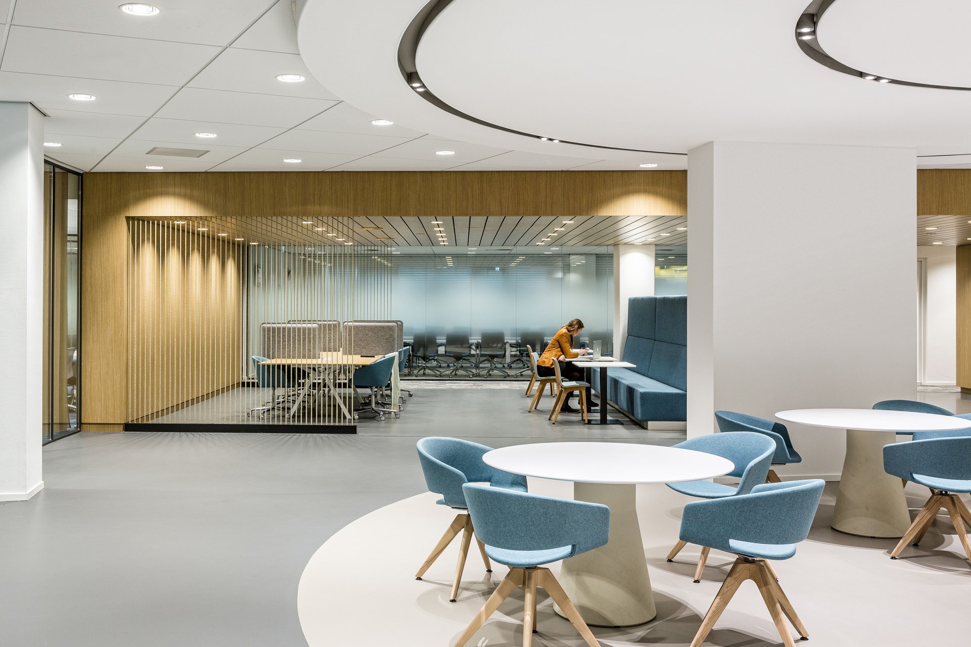 Office design with natural wood and blue accents