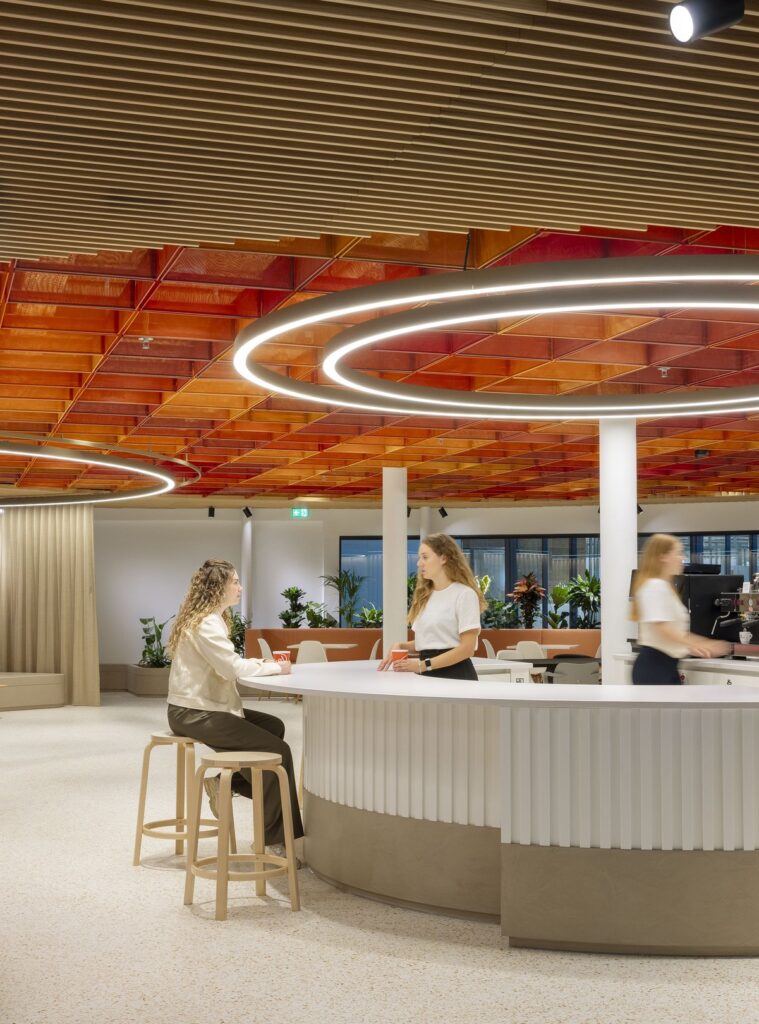 Heart-shaped community space with colorful ceiling feature