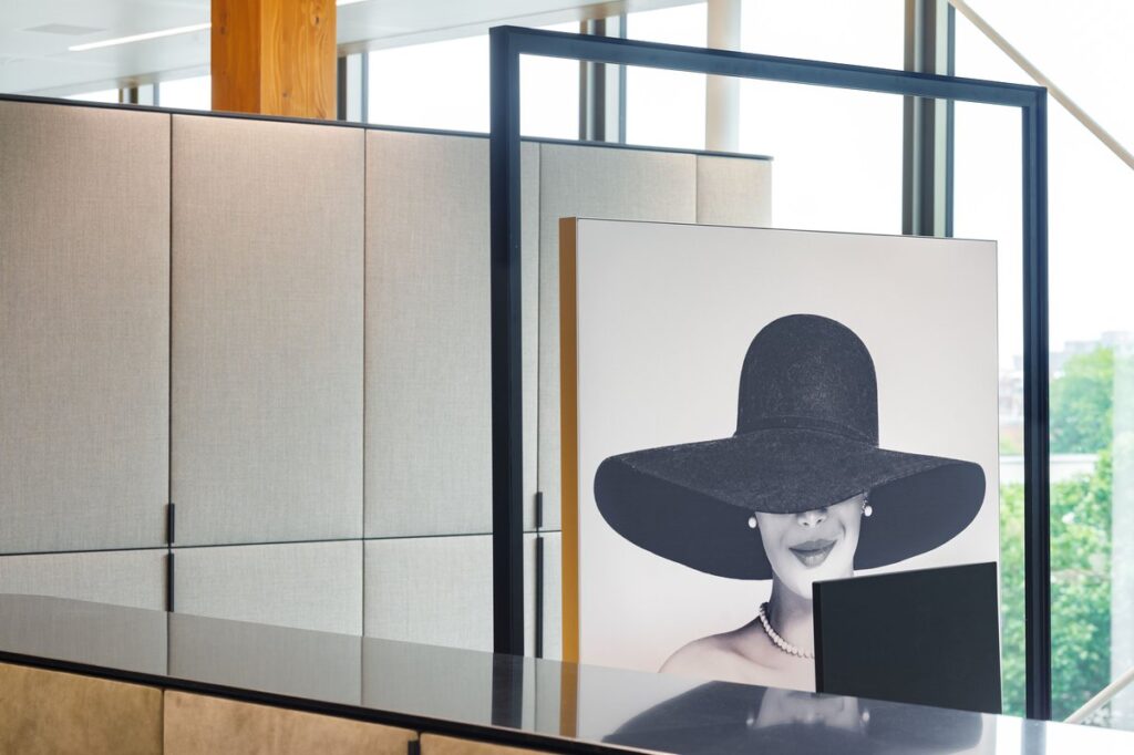 Workbenches transformed into pedestals with framed canvasses