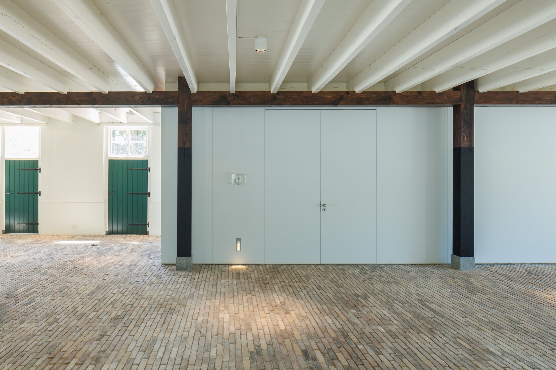 Historic barn in decay converts to visitor center as part of the transformation of a farm ensemble