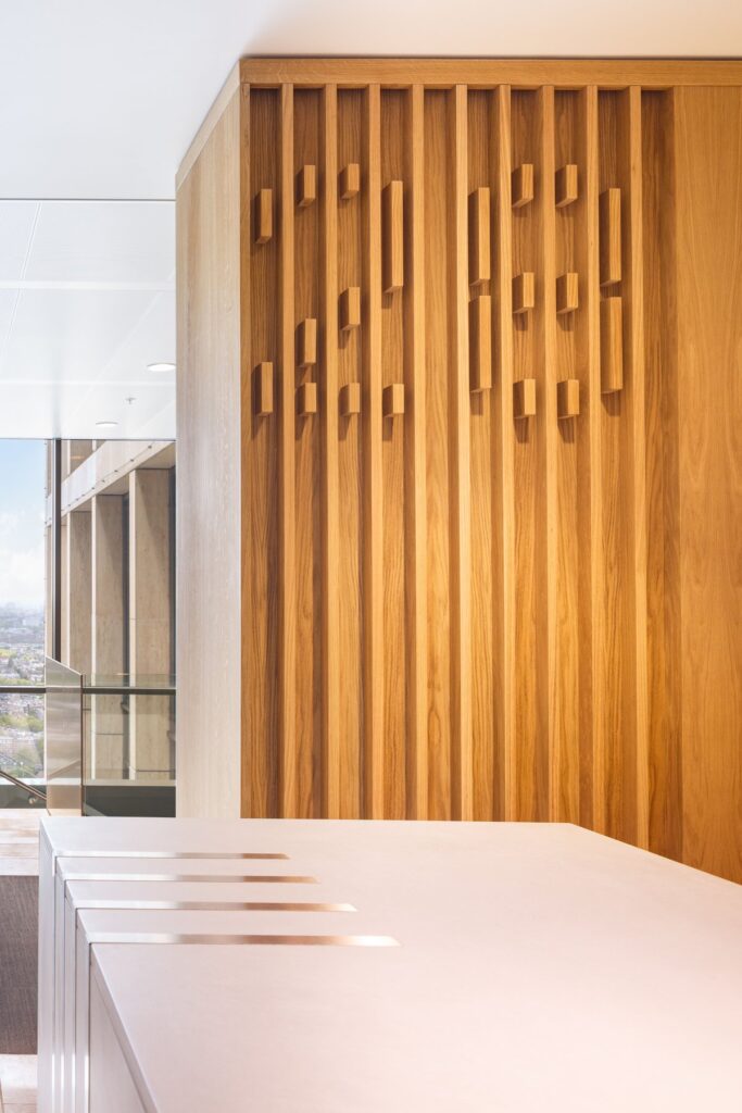 Interior design with oak lamella and walnut lamella in NautaDutilh penthouse.