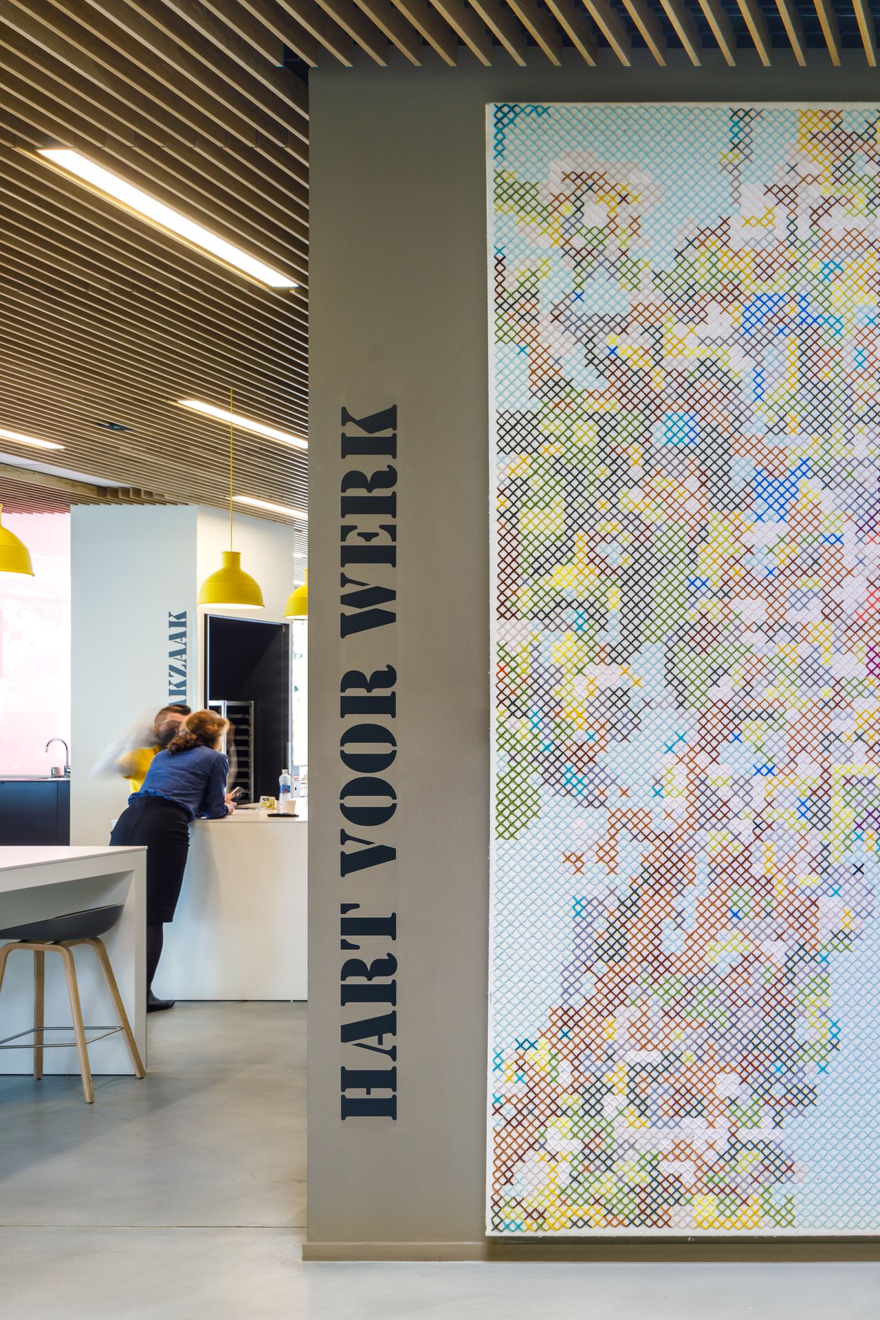 Handmade felt wall panels are integrated into the interior design